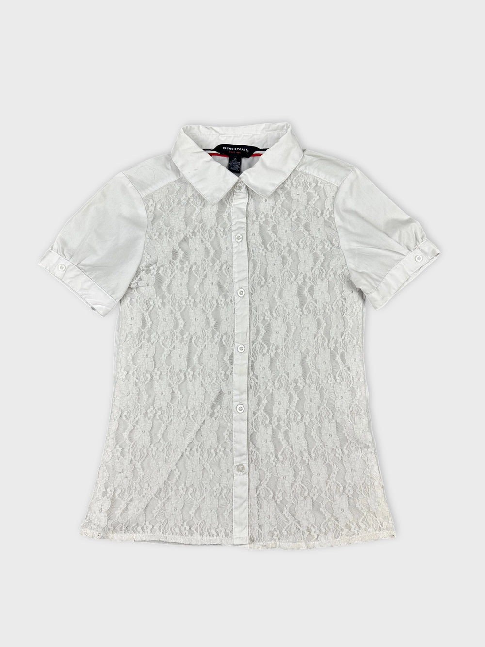 Front view of a white short sleeve shirt with lace detailing
