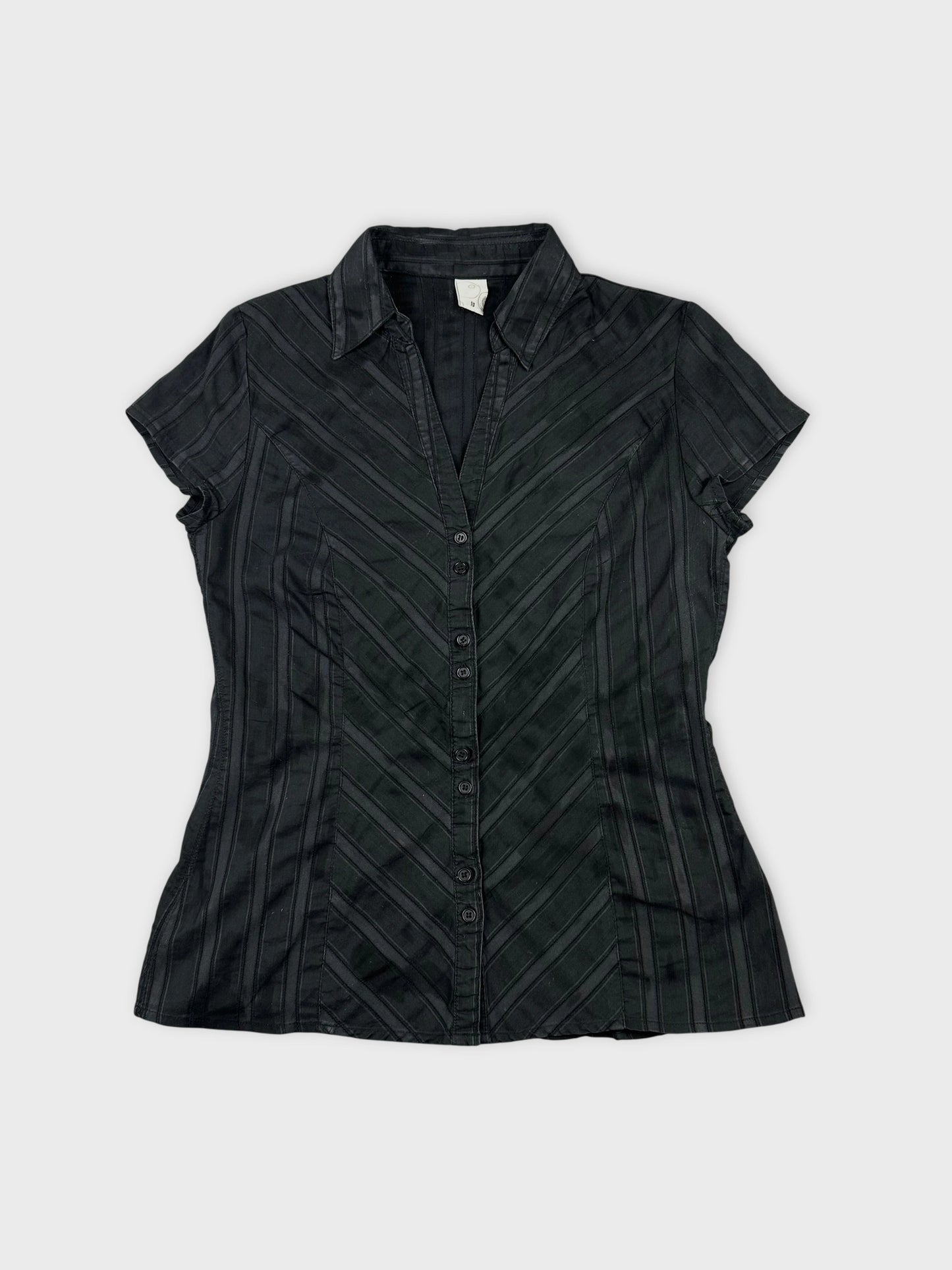 Front view of a black short sleeve shirt with a chevron pattern.