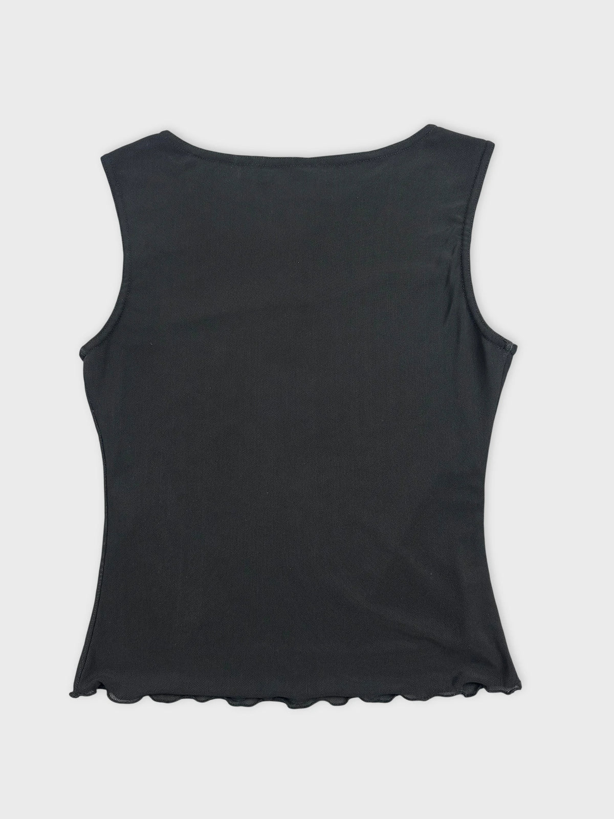 Back view of a black sleeveless top with scalloped hem.