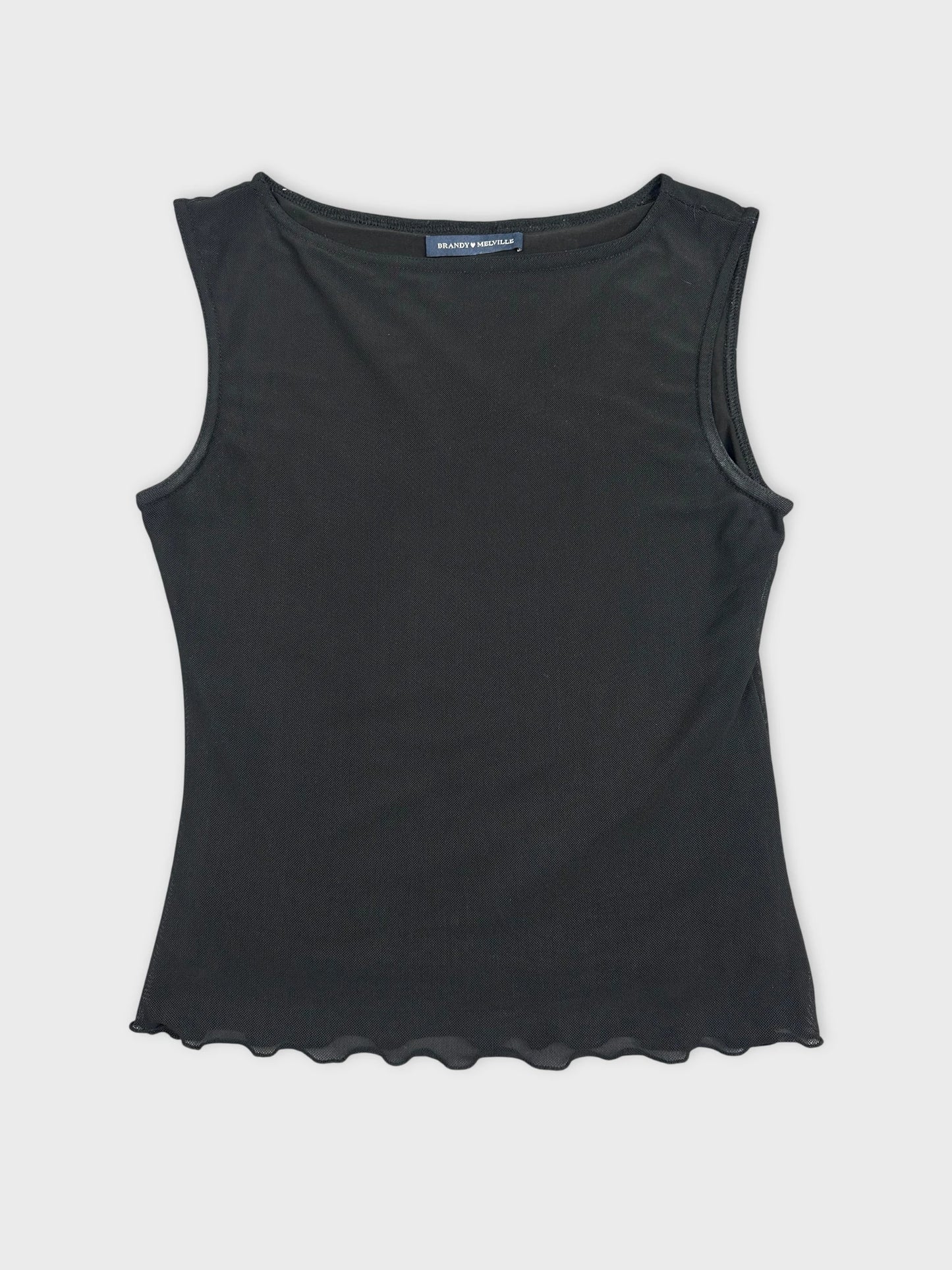 Black sleeveless top with scalloped hem in front view.