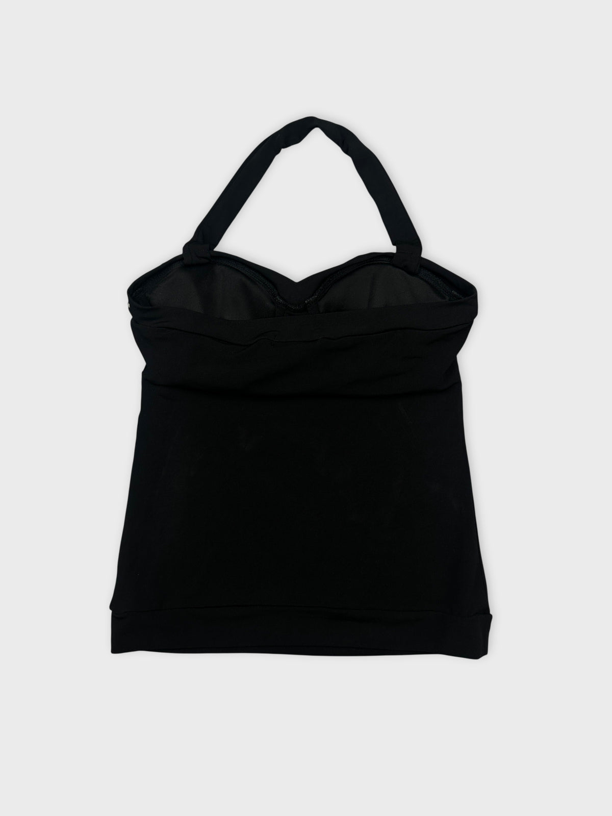 Back view of a black sleeveless top with adjustable straps.