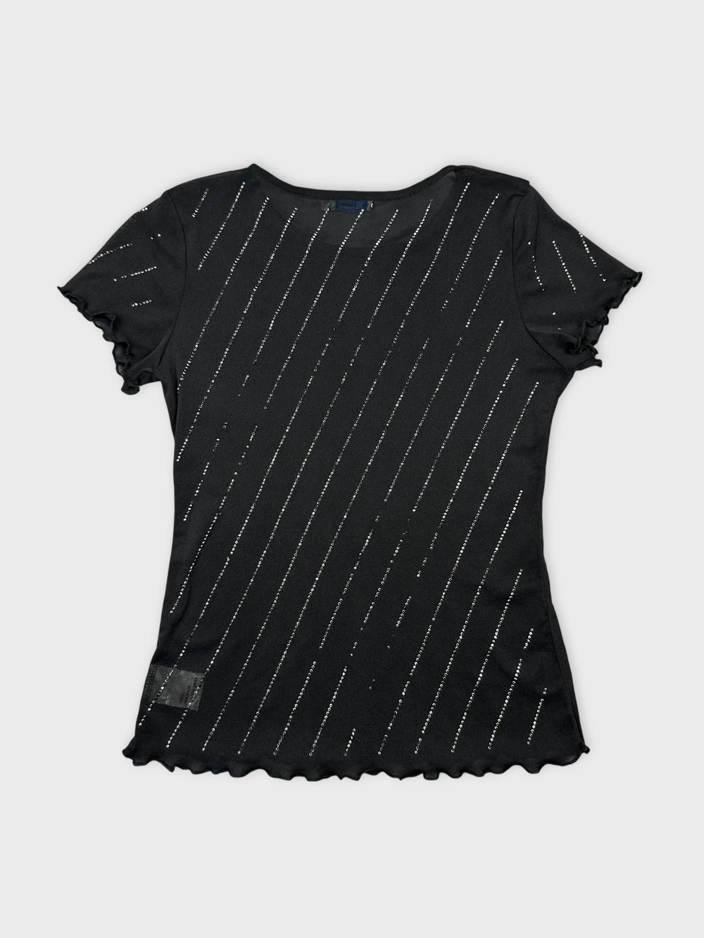 Back view of black short sleeve top with silver diagonal stripes