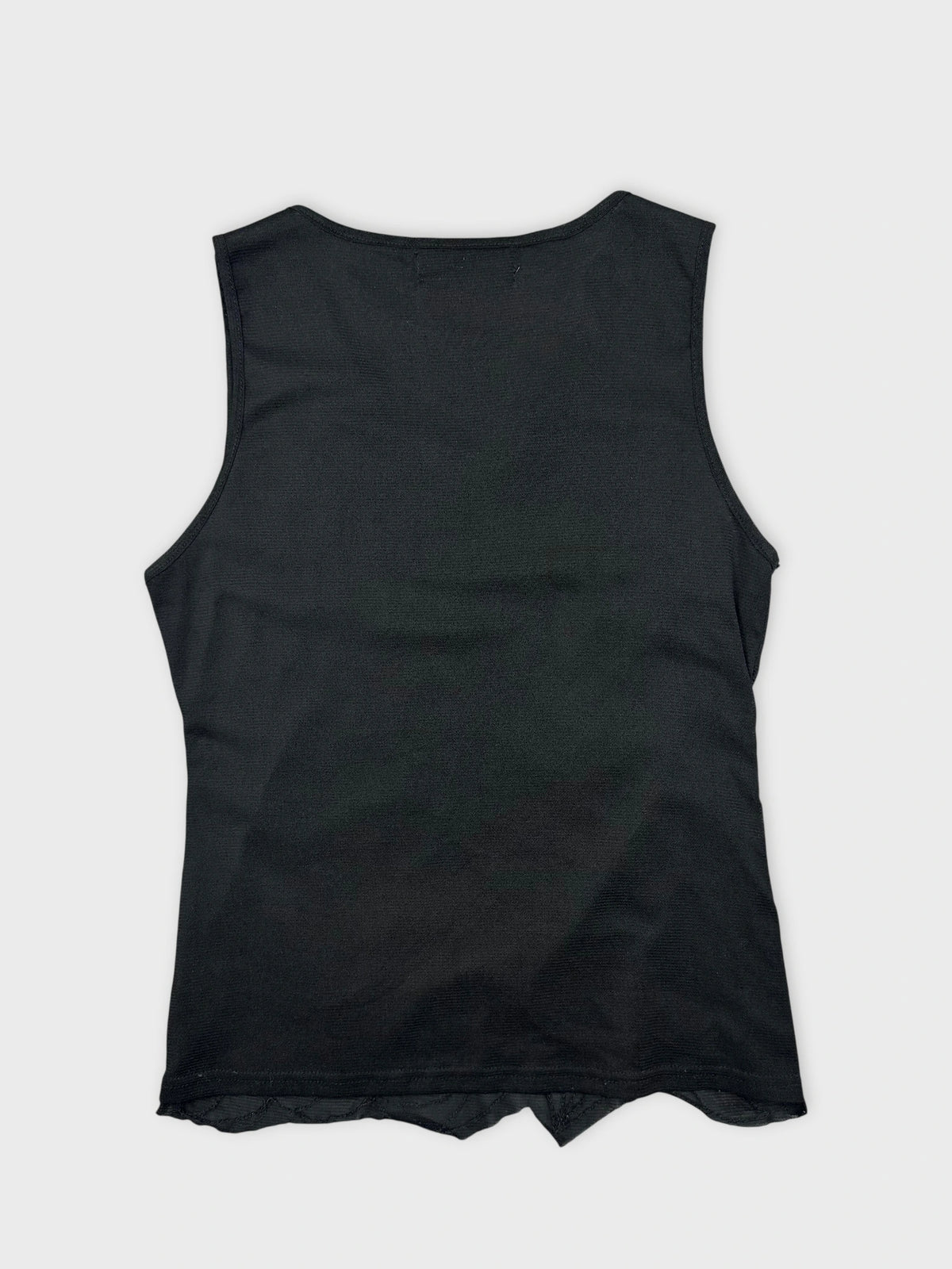 Back view of a black sleeveless top featuring a curved hem.