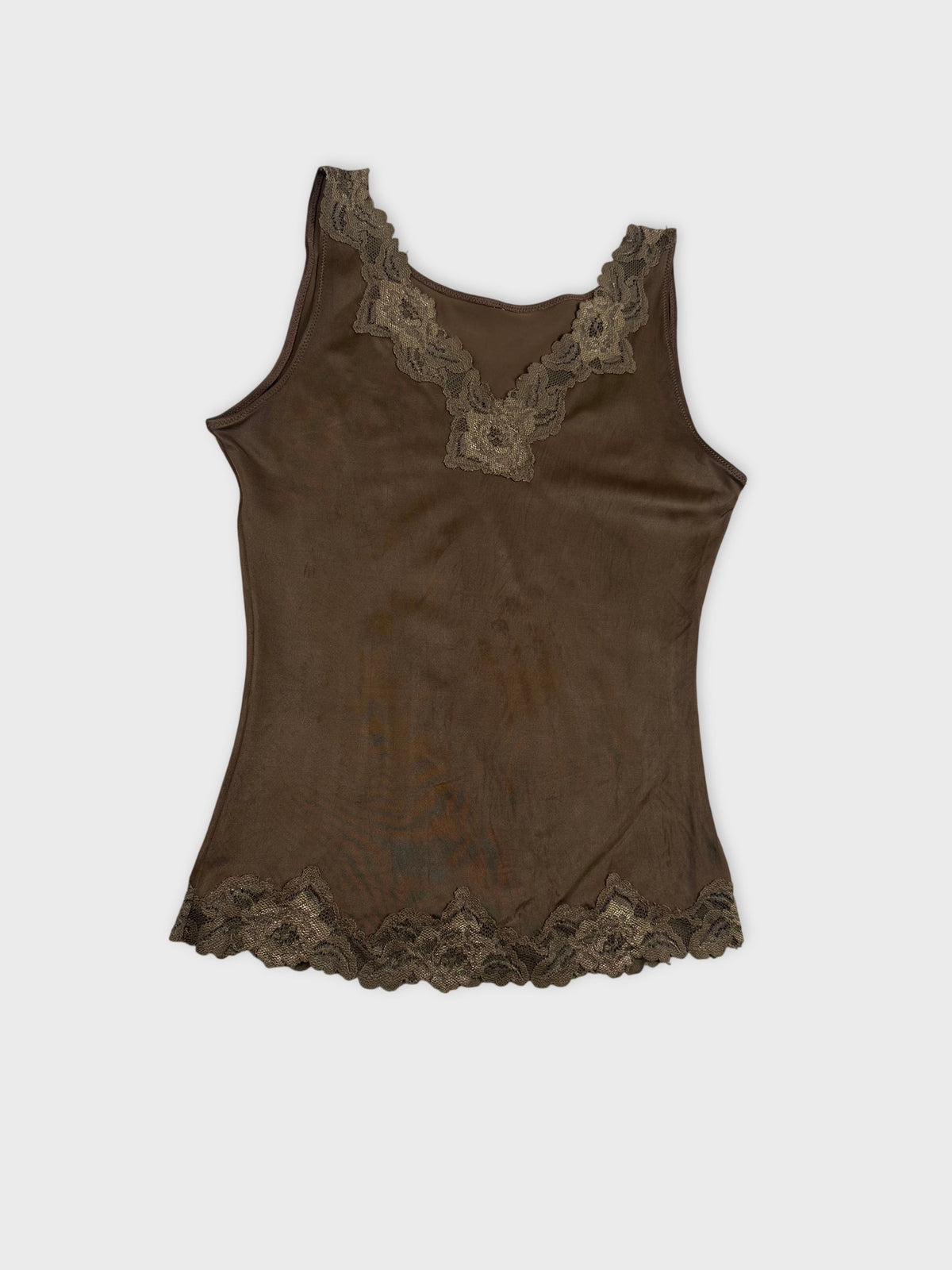 Detail view of brown tank top with intricate lace trim