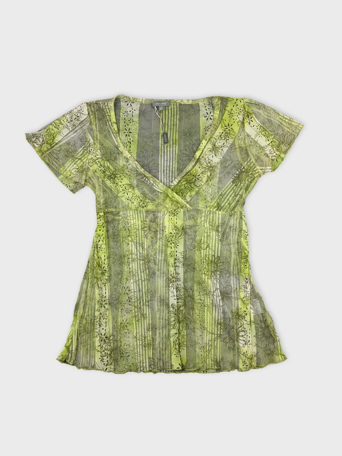 Front view of a short sleeve top in bright green with floral patterns.