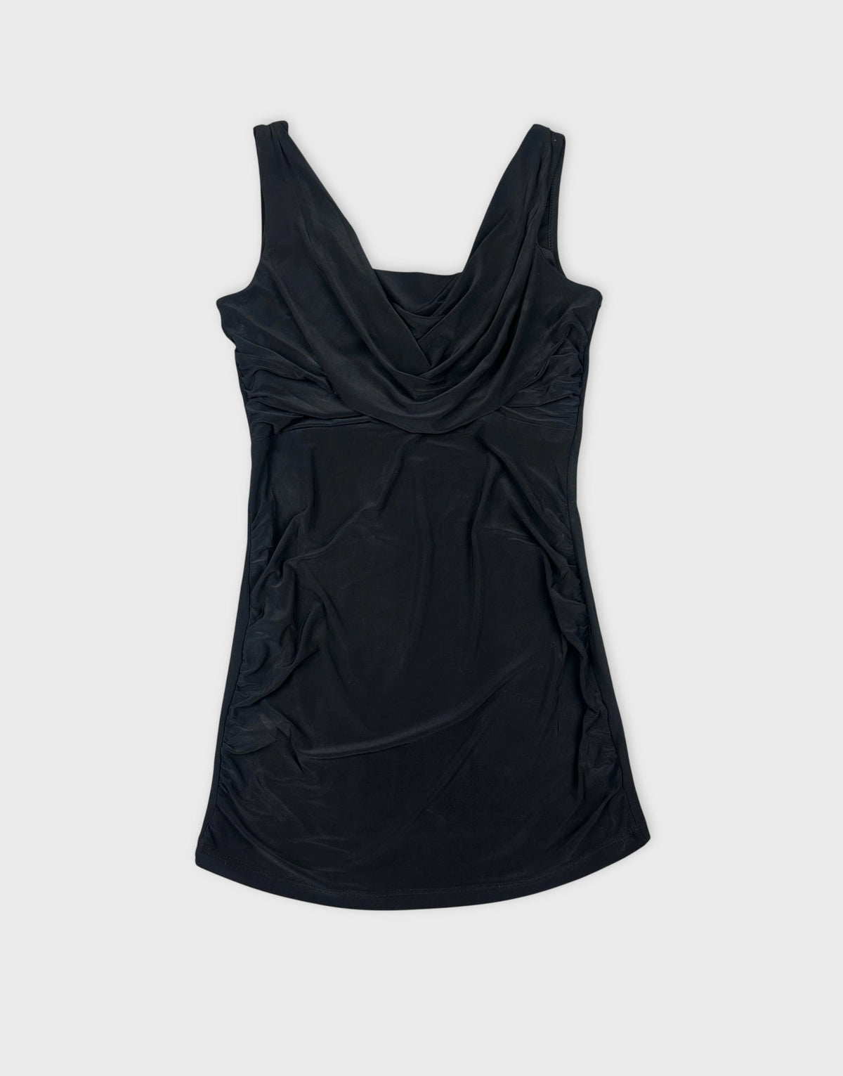 Front view of a black sleeveless top featuring draped neckline.
