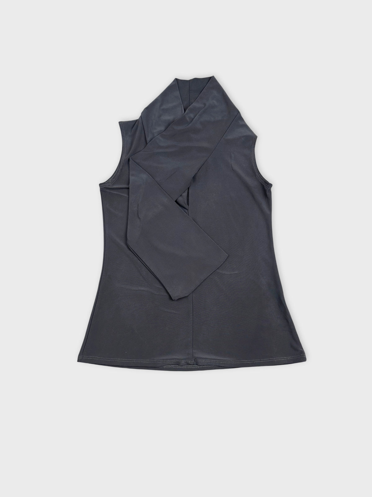 Black sleeveless top with wrap design front view