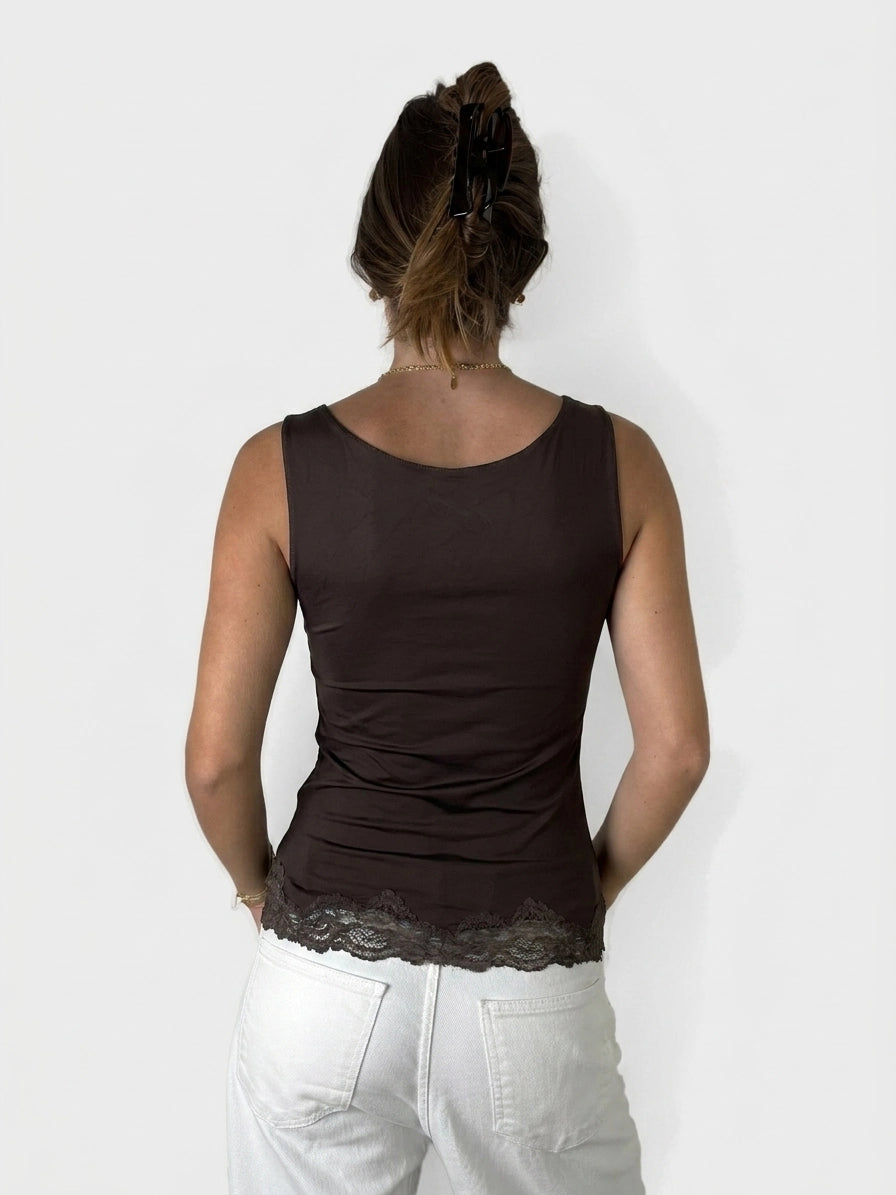 Back view of a brown sleeveless top with lace trim.