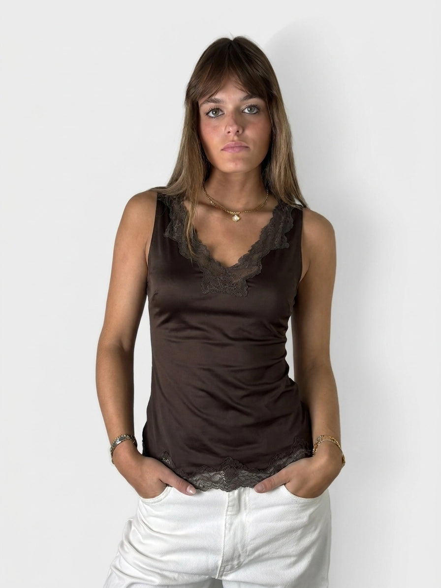 Front view of a brown sleeveless top with lace trim.
