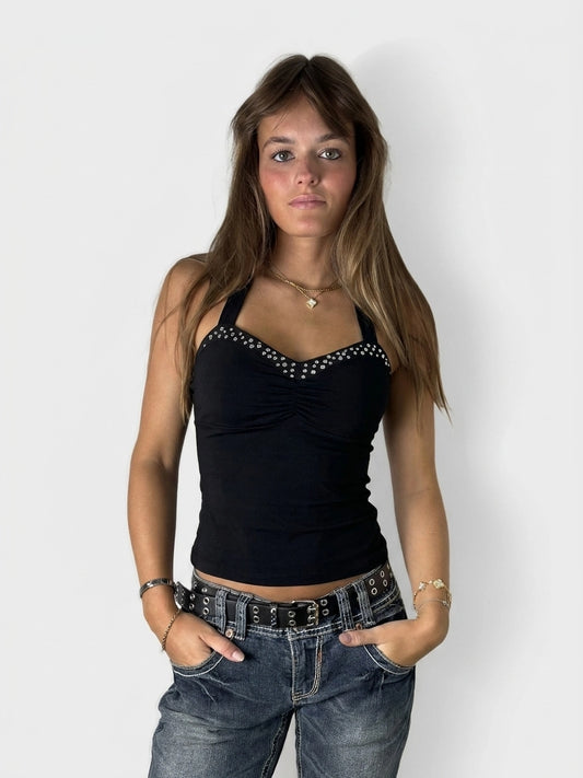 Black sleeveless top with studded trim, shown in front view.