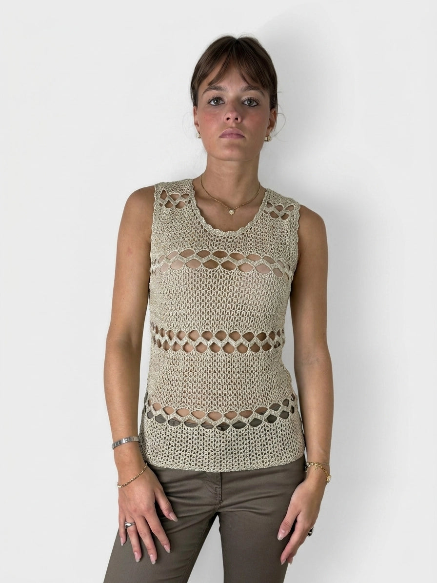Front view of a beige sleeveless top featuring a lace design.