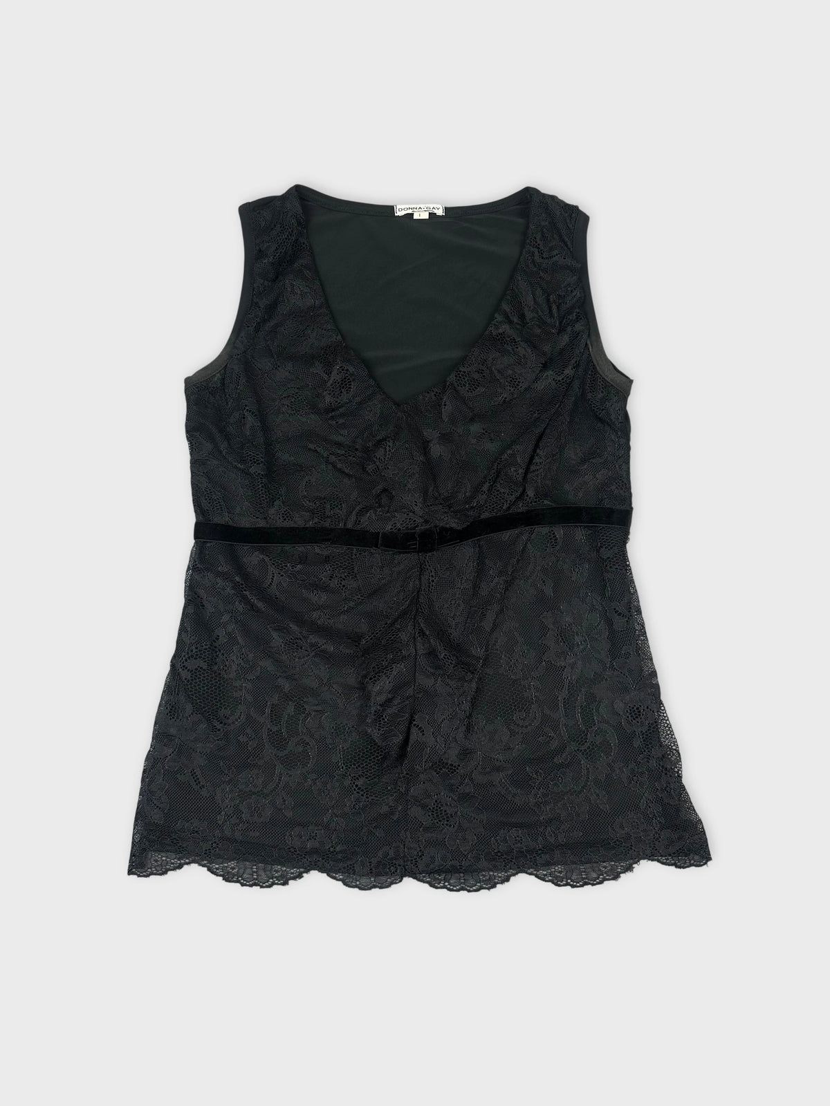Front view of a black lace sleeveless top featuring a scalloped hem.