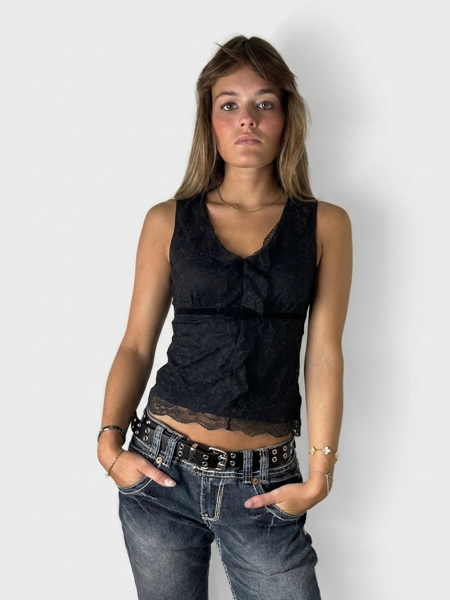 Black sleeveless top with lace trim, front view.