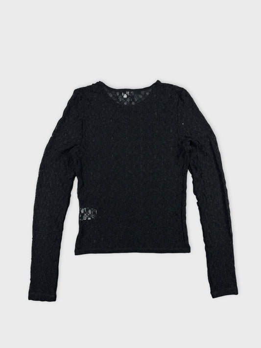 Black long sleeve top with lace pattern back view.