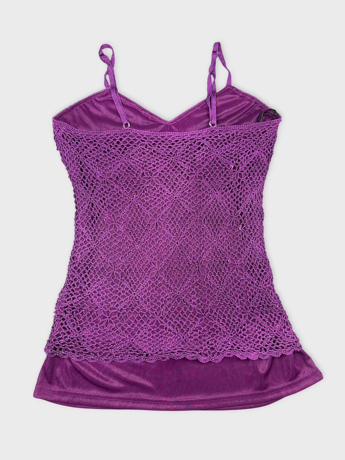 Back view of purple lace top with straps and layered design.