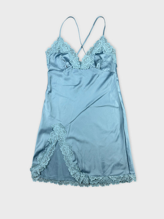 Front view of a light blue satin camisole with lace trim.