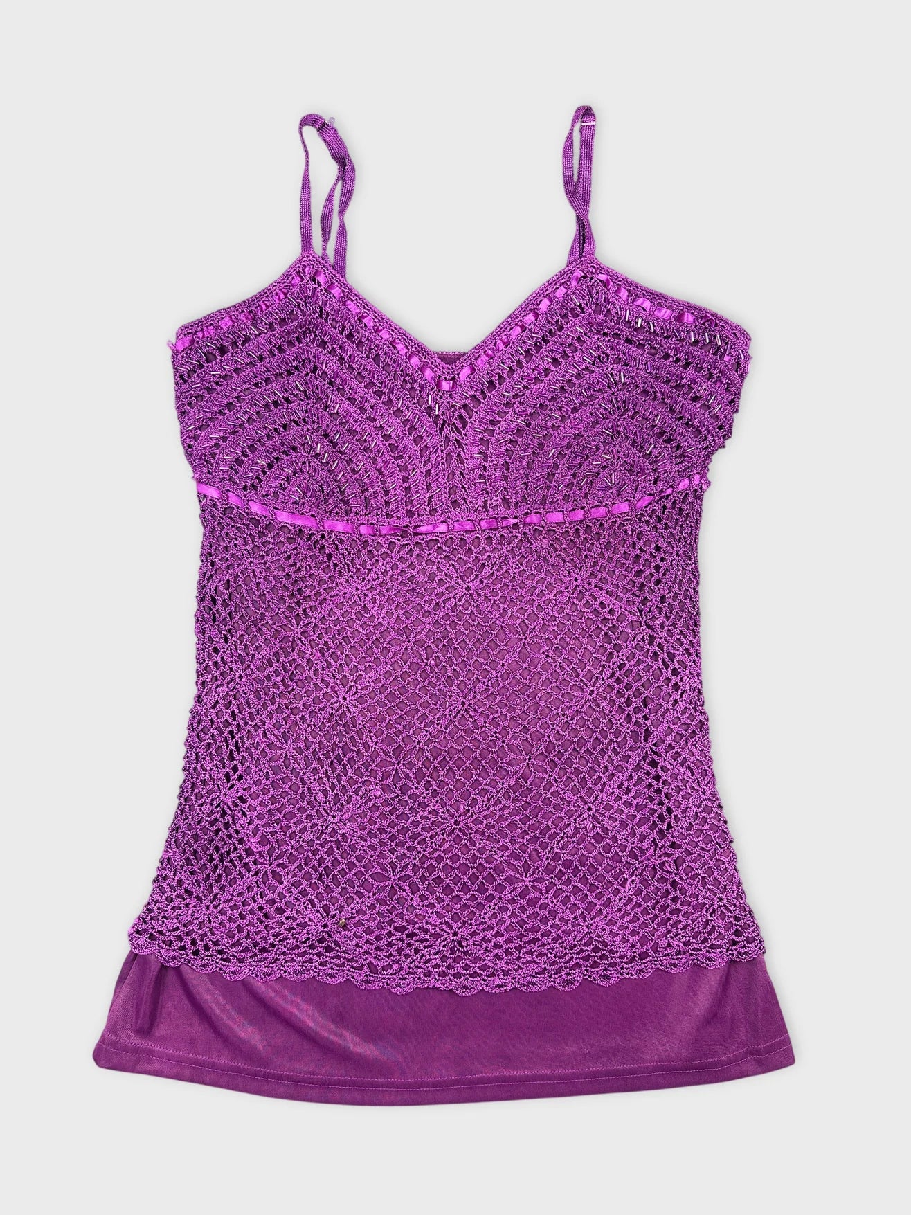 Front view of a purple crochet tank top with adjustable straps.