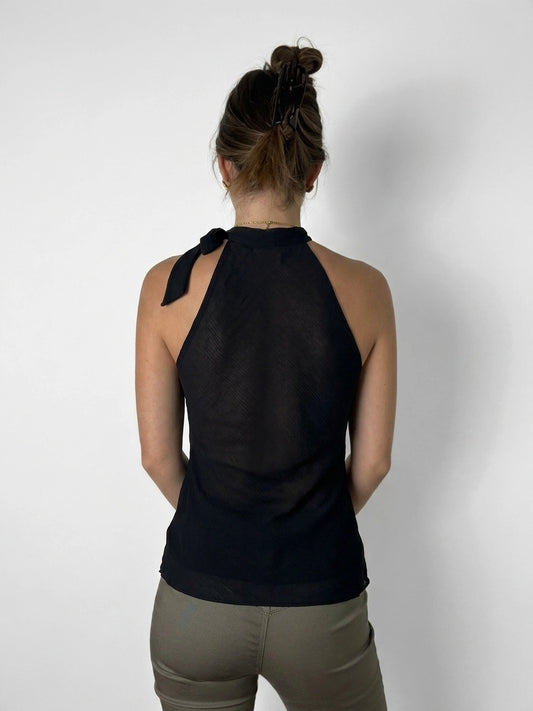 Back view of a black halter top with tie detail.