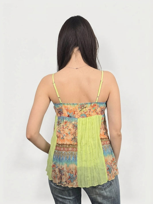 Back view of a bright yellow women’s upper body top with floral print.