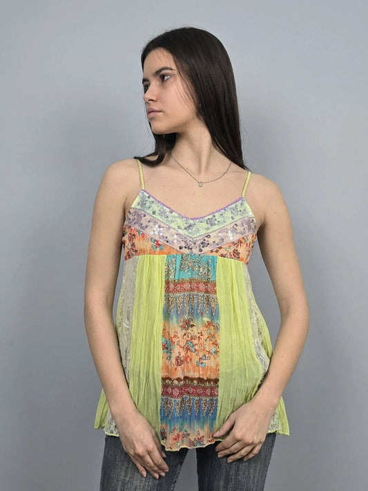 Front view of a colorful vintage women's upper body top with floral patterns.