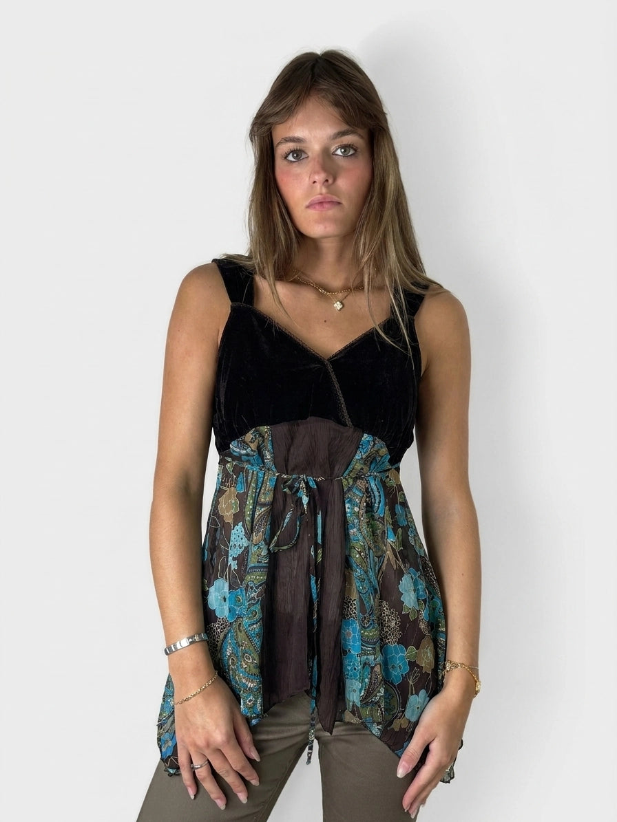 Front view of a vintage women’s upper body shorts in black with a floral print.