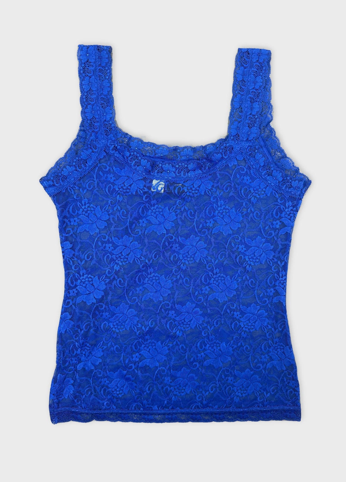 Back view of a blue lace tank top with floral pattern.