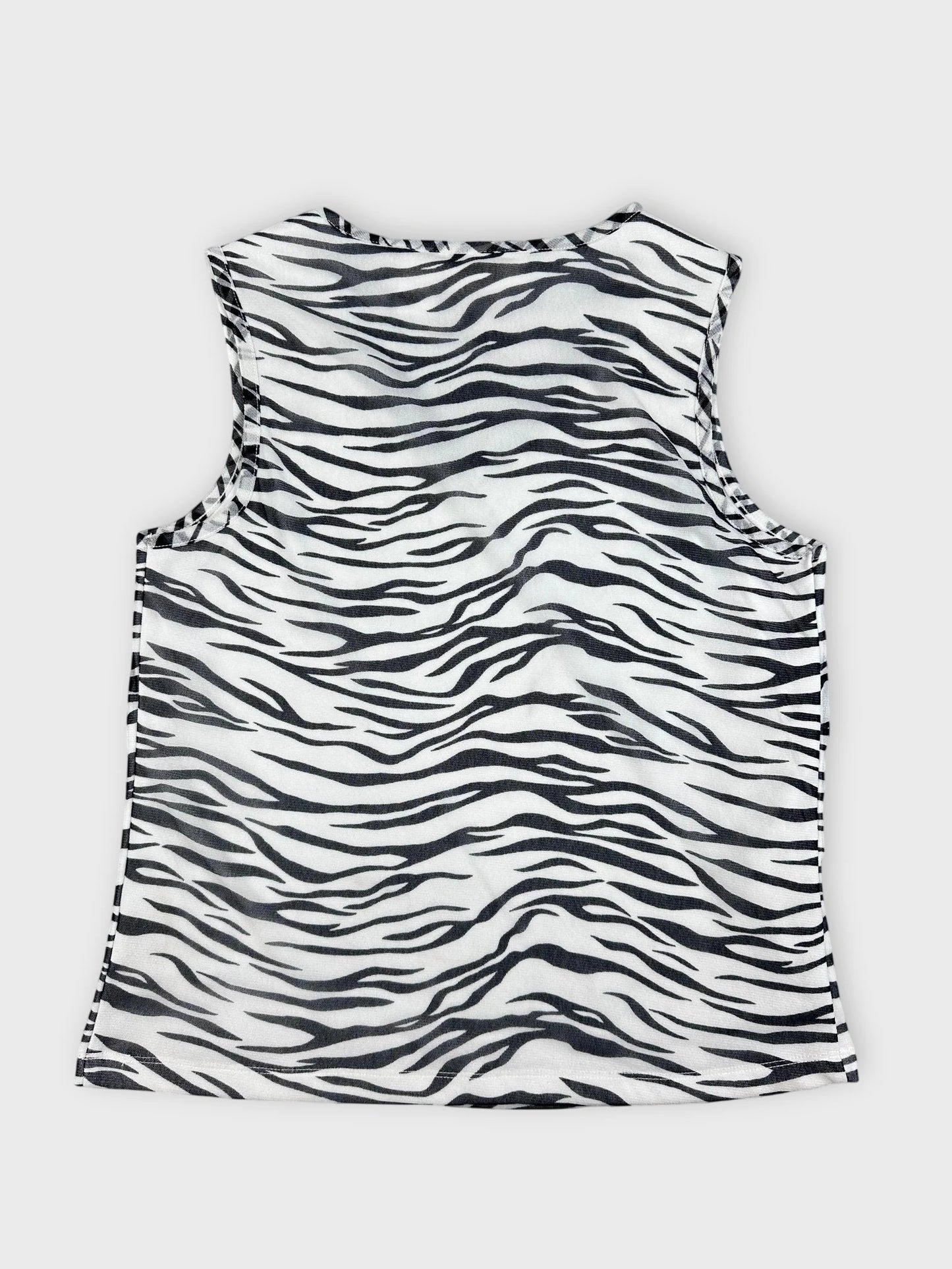 Back view of a sleeveless top featuring a black and white zebra stripe pattern.