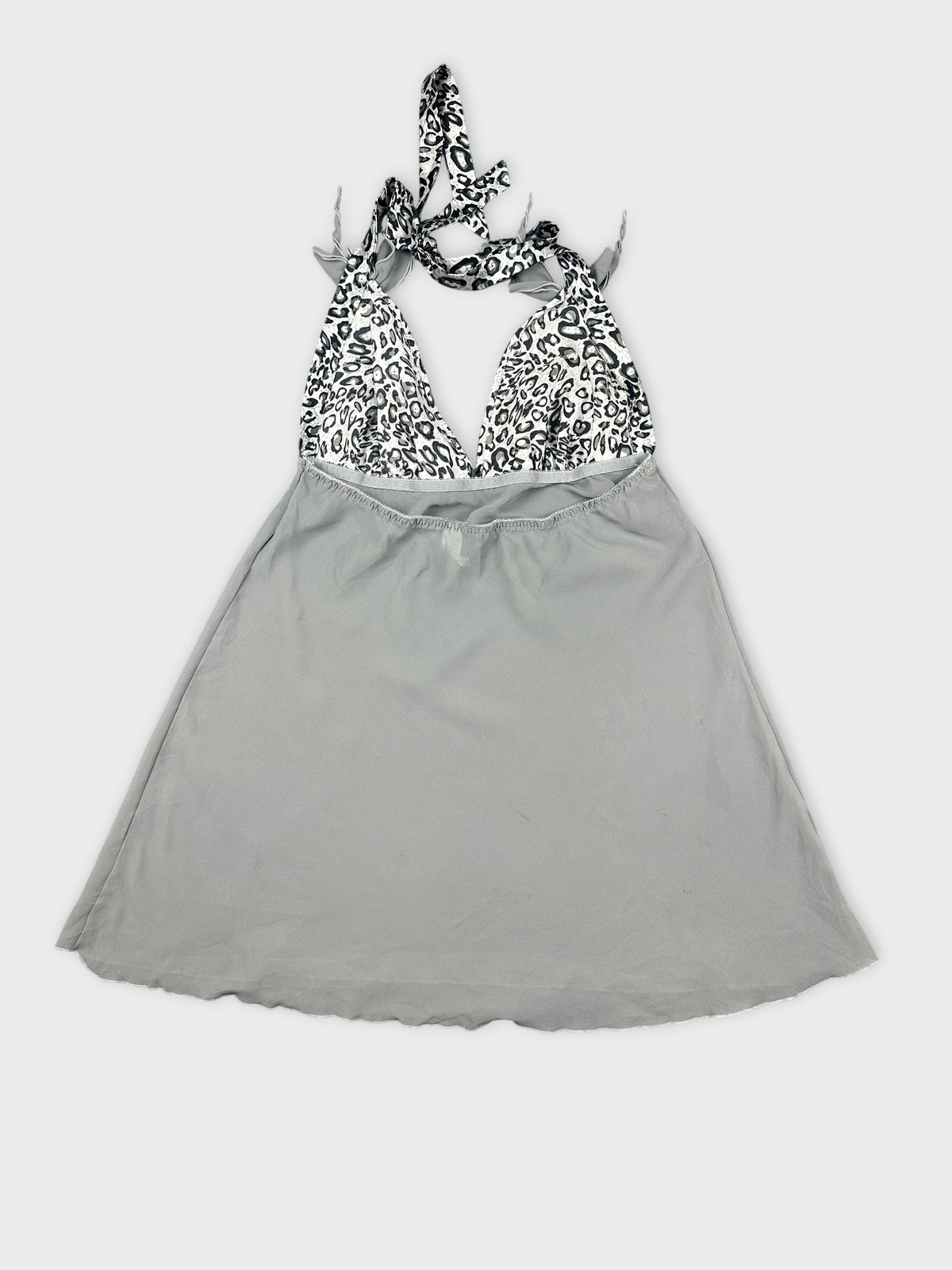 Back view of a gray halter top with a leopard print bodice.