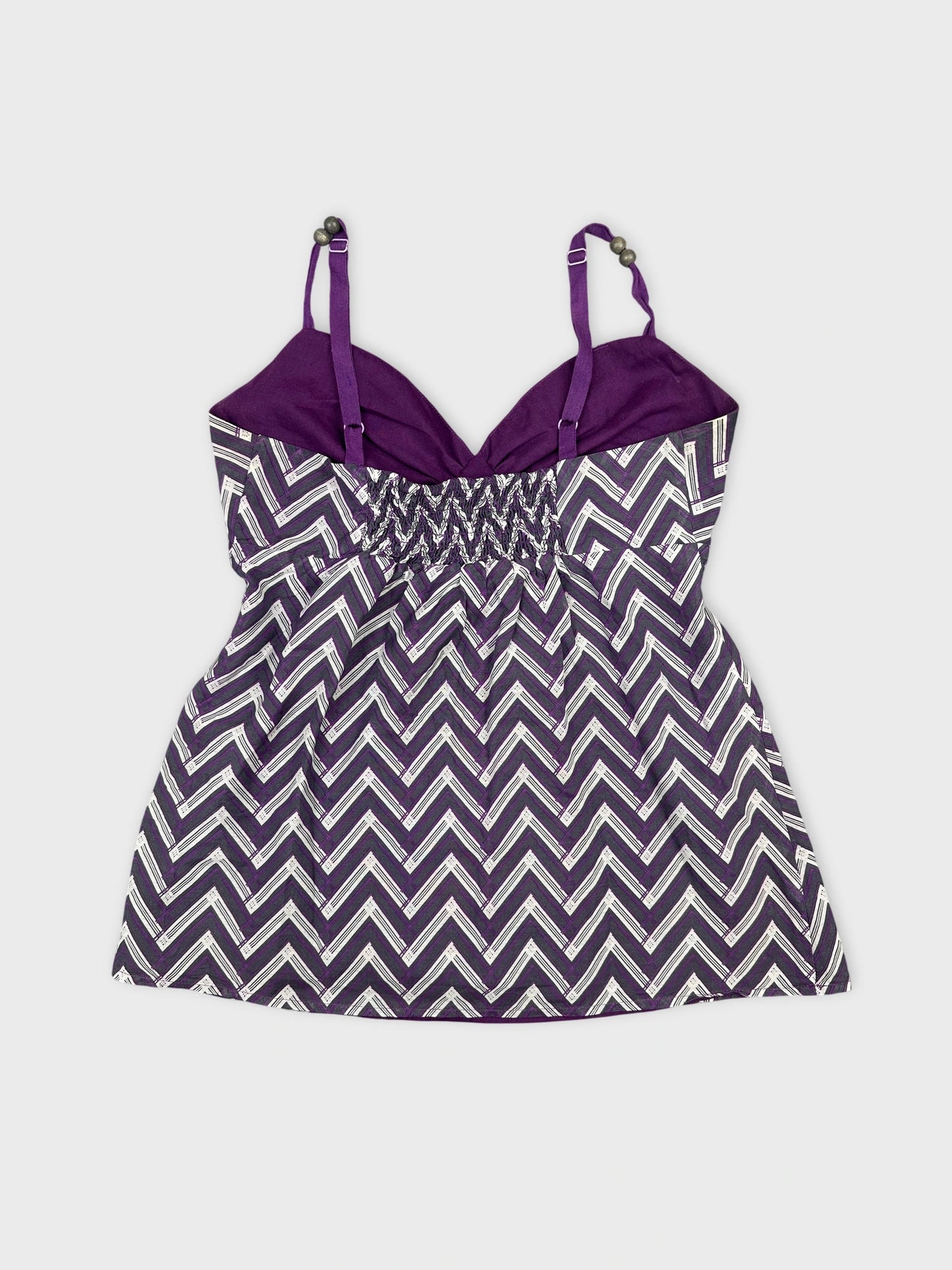 Back view of purple top with zigzag pattern and adjustable straps.