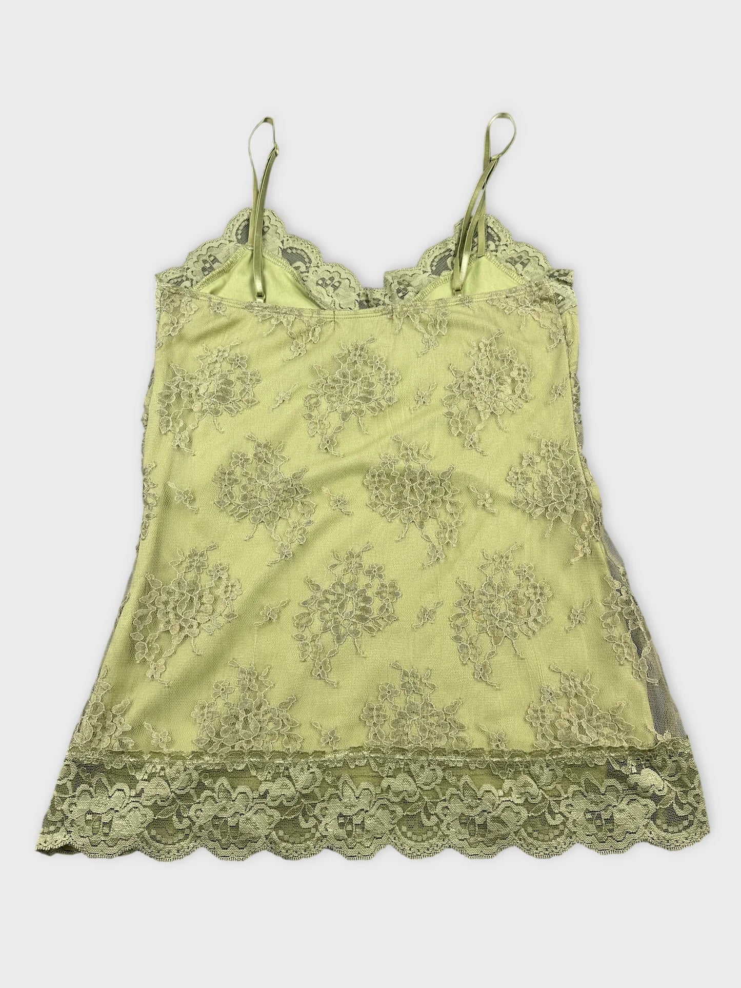 Back view of a light green lace cami top with floral pattern.