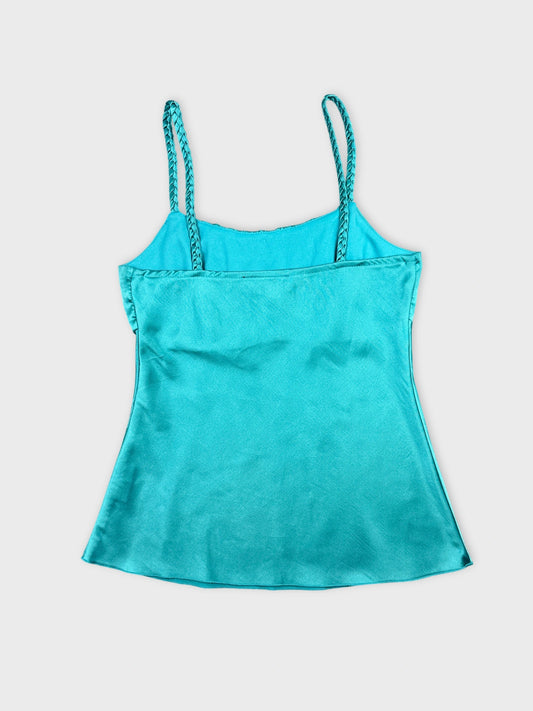 Back view of a turquoise women's tank top with braided straps.