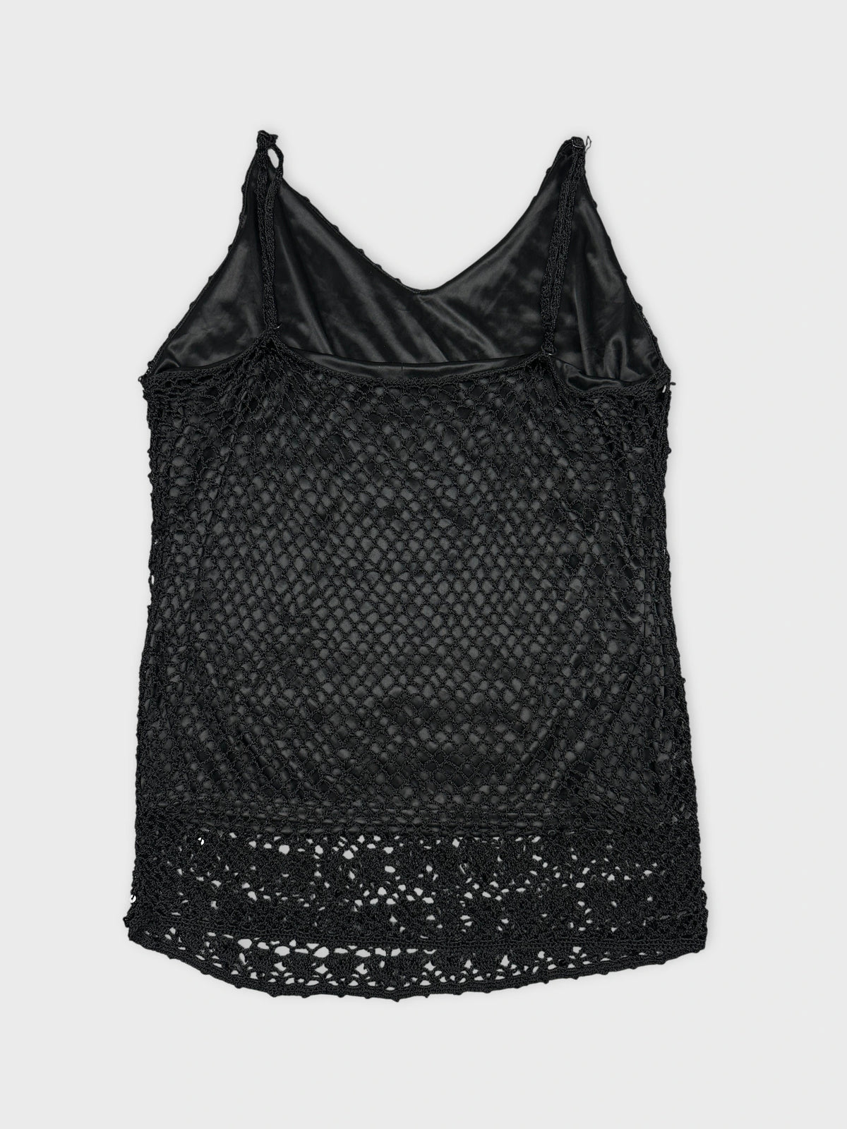 Back view of a black tank top with a lace trim.
