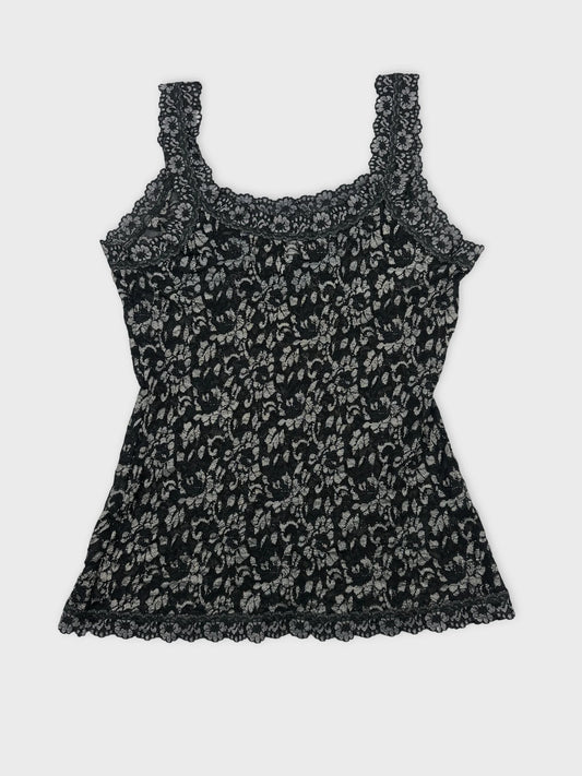 Back view of a black floral lace tank top with intricate trim.