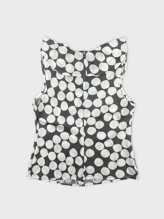Back view of a sleeveless top in gray with white polka dots.
