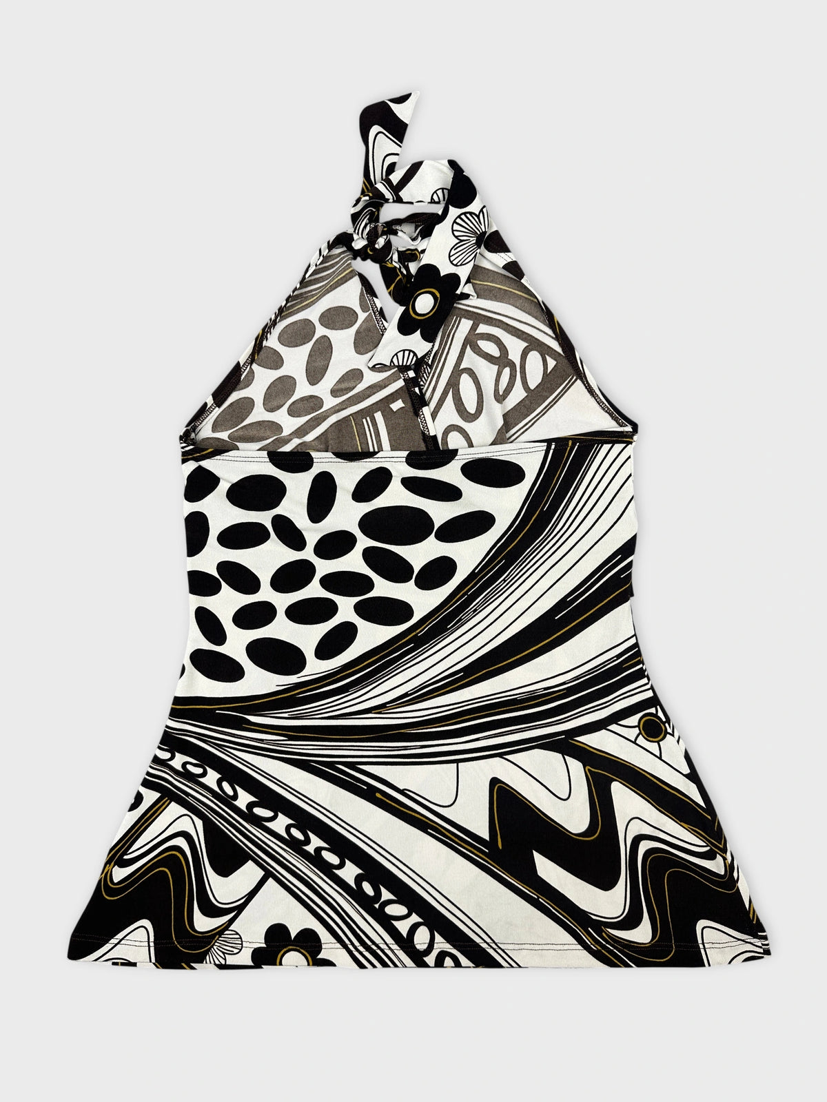 Back view of a halter top in black and white with a swirling pattern.