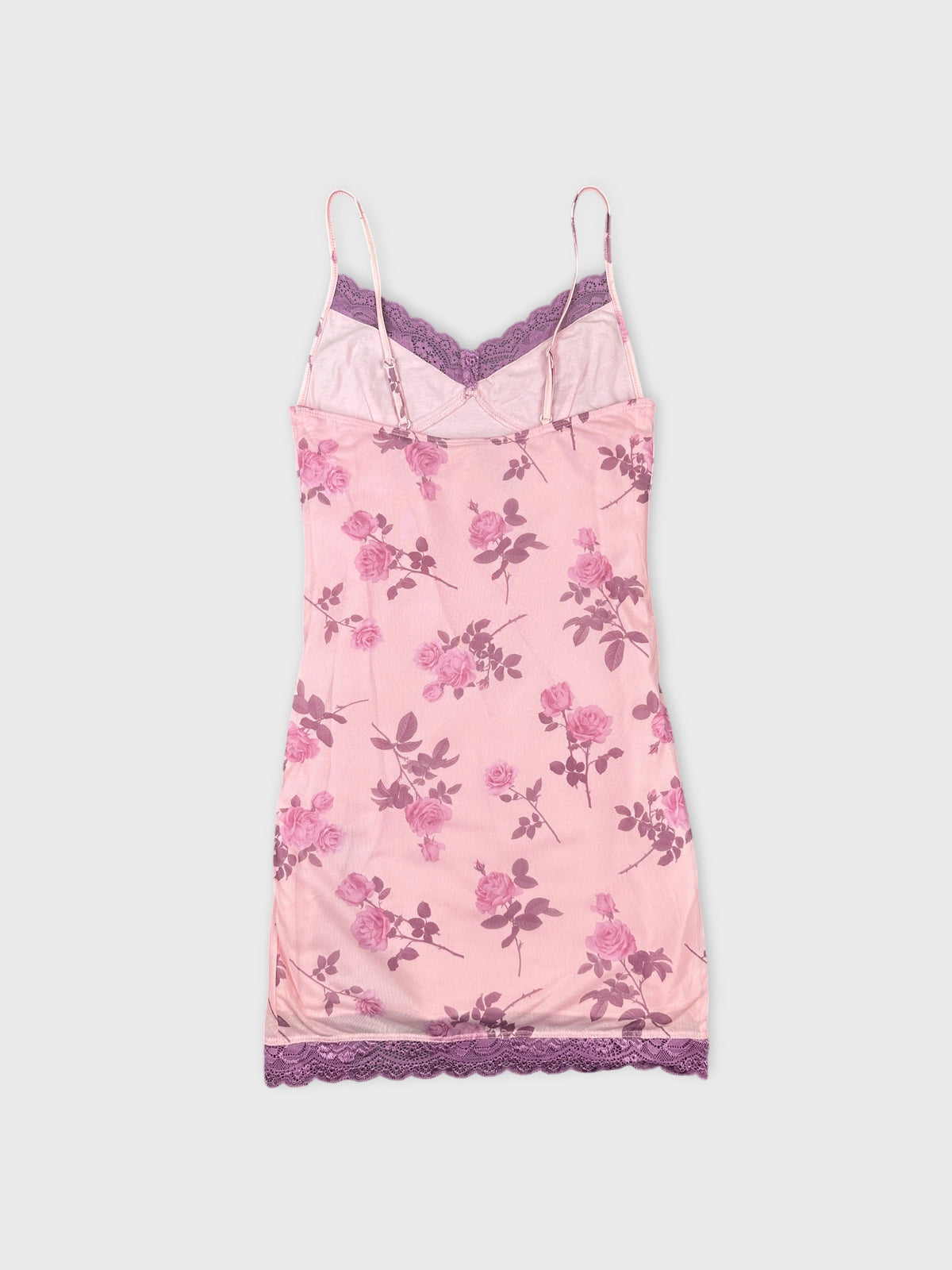 Back view of a pink floral camisole with lace trim.