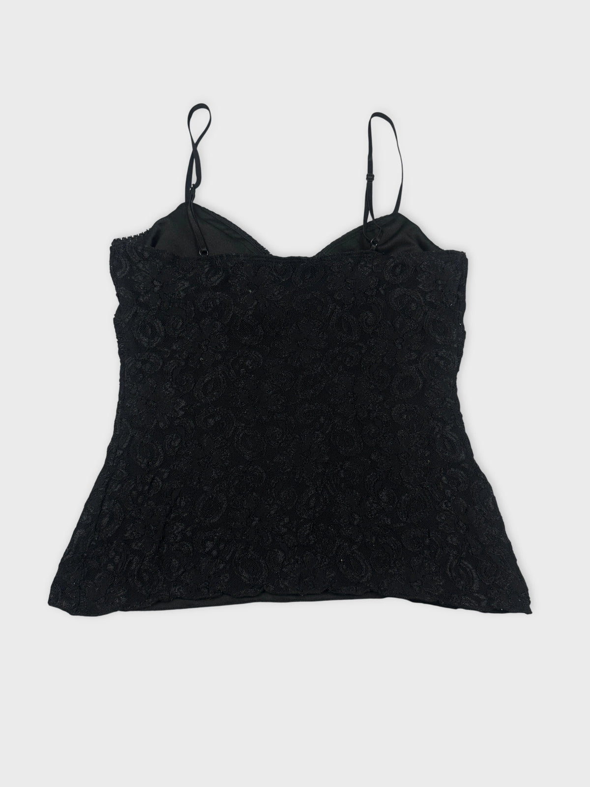 Back view of a black women's top with floral lace detail.