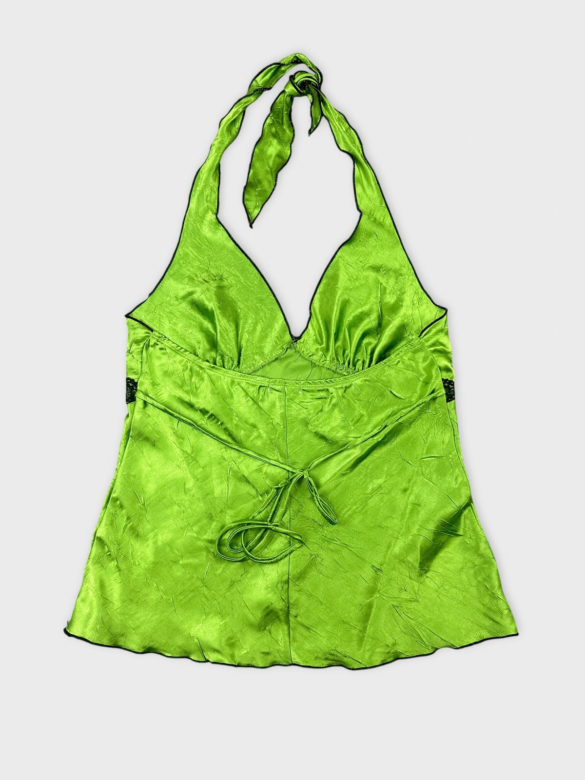Back view of a green satin halter top with a tied neck detail.
