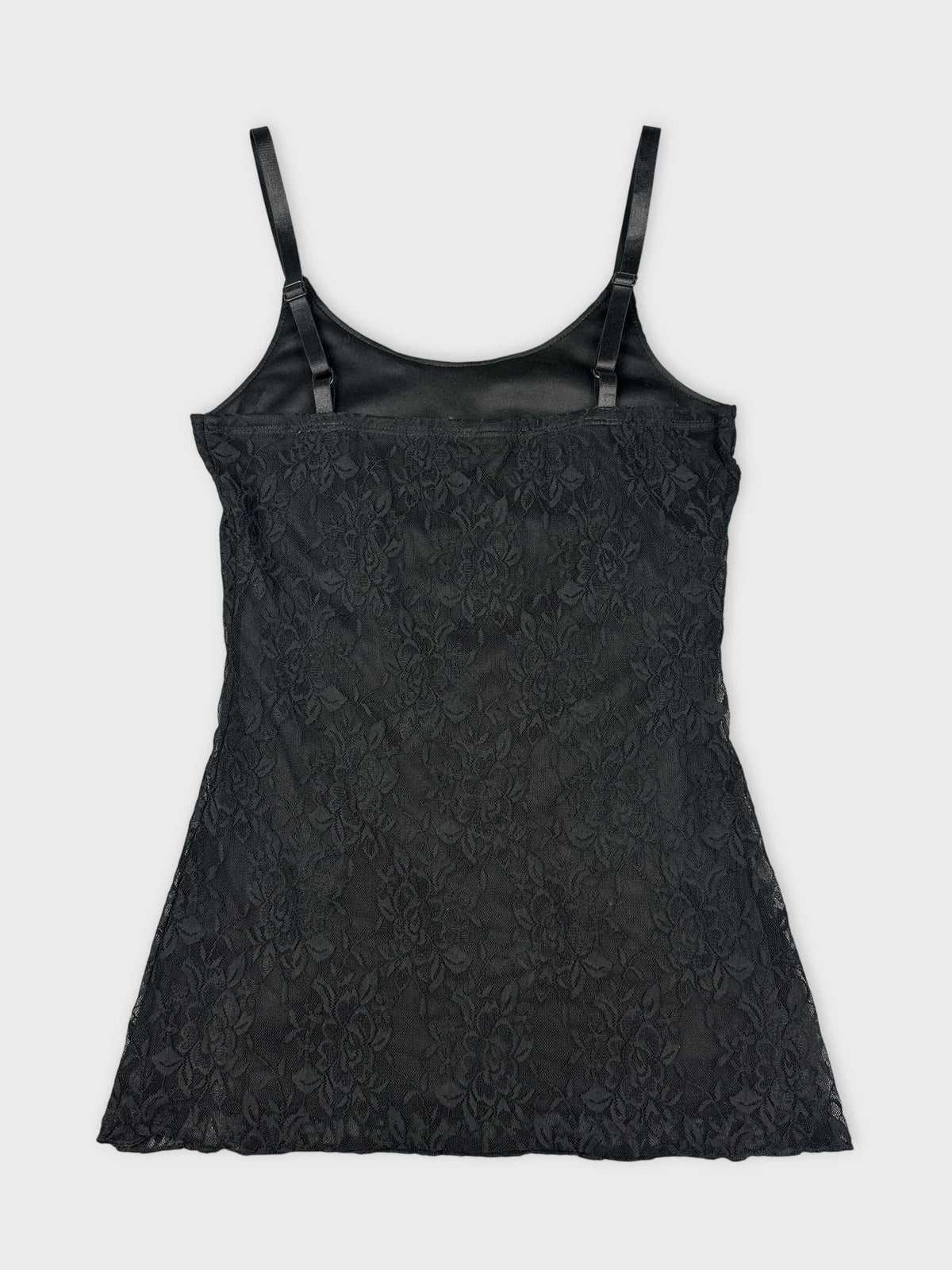 Back view of a black lace women's top with adjustable straps.