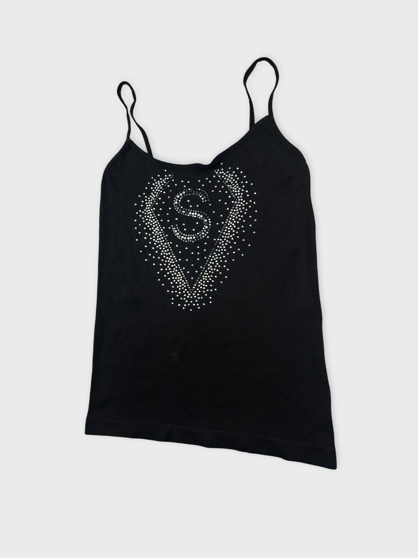 Detail view of a black tank top featuring a rhinestone heart design.