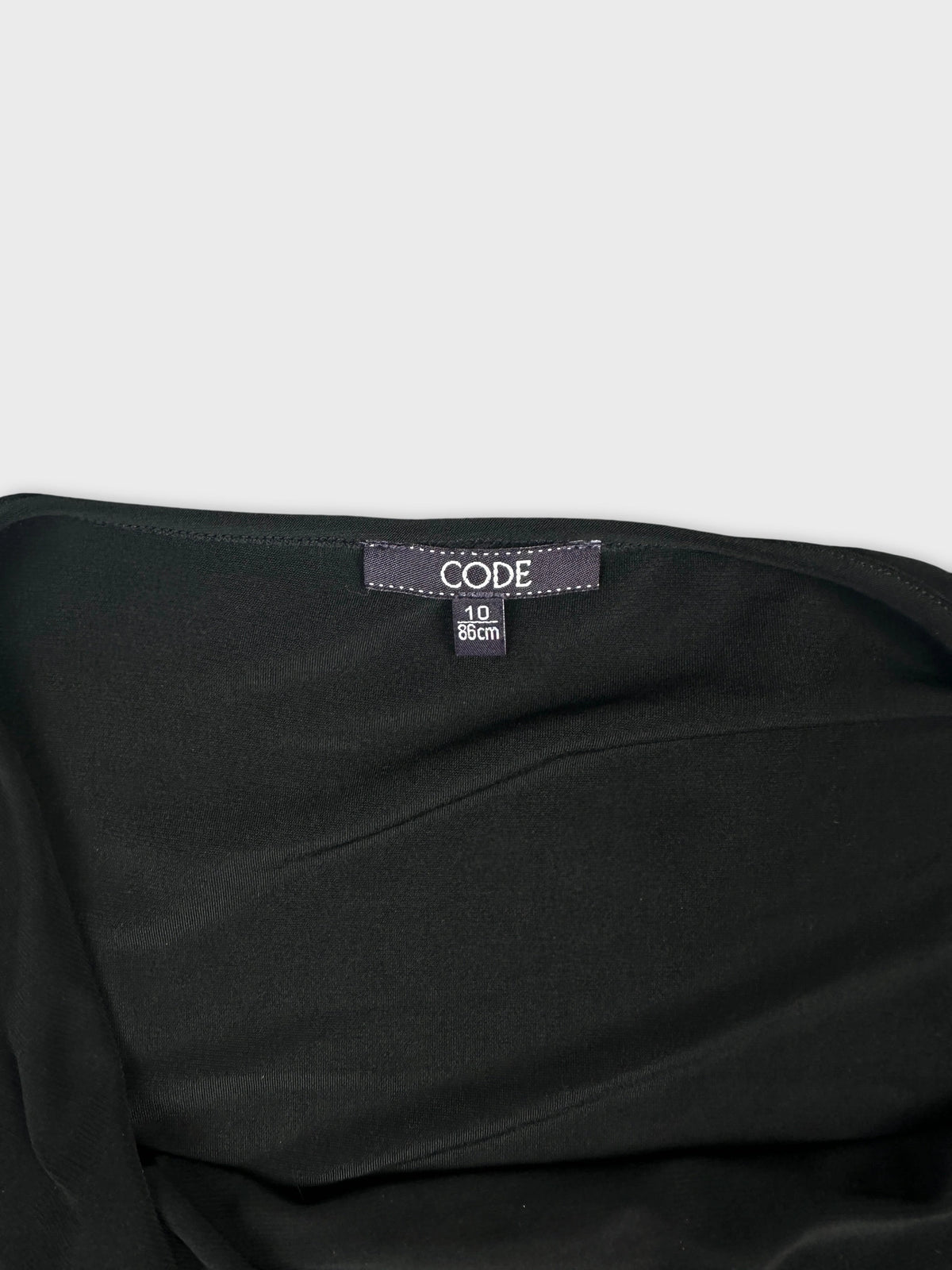 Detail view of a black upper body top featuring a smooth ribbed texture.