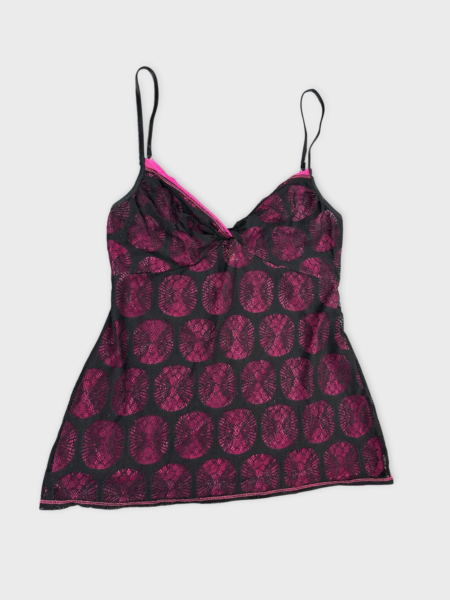 Black camisole top with pink geometric pattern detail view