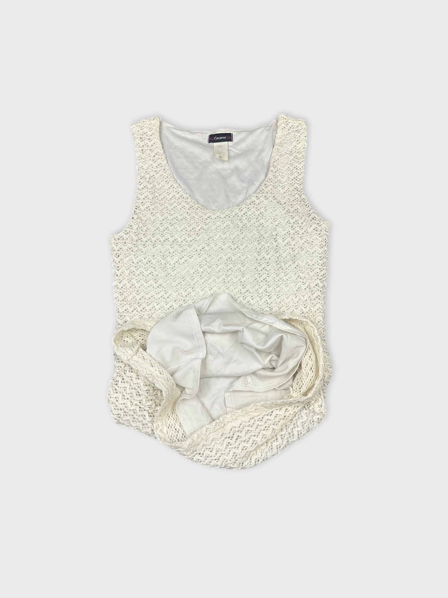 detail view of a white textured tank top with a scoop neck