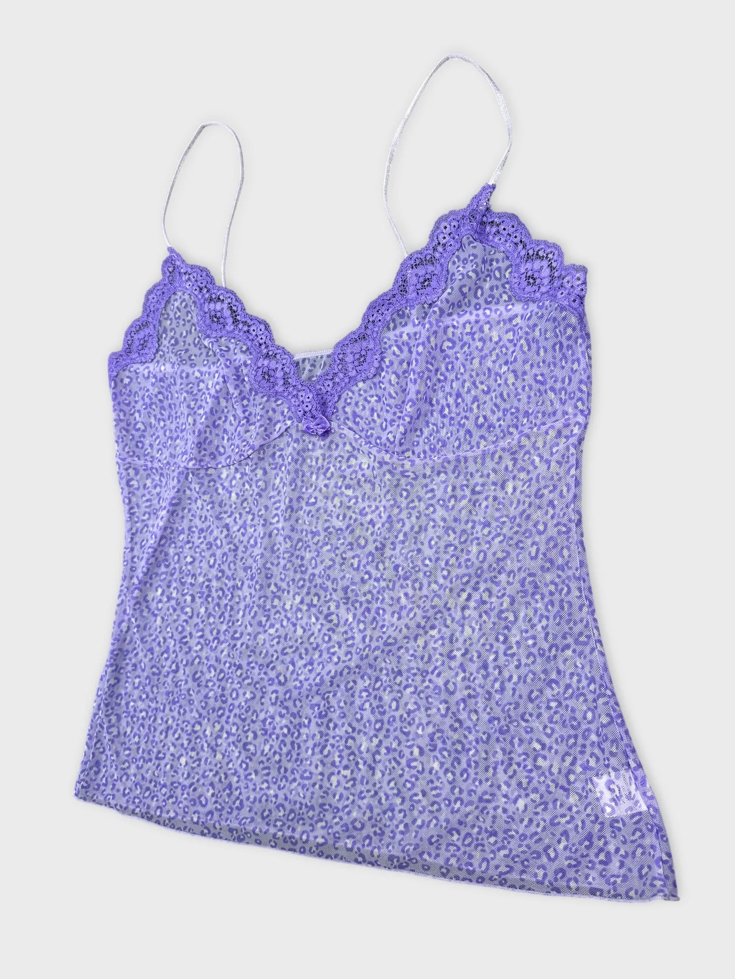 Detail view of a purple leopard print camisole with lace trim straps.