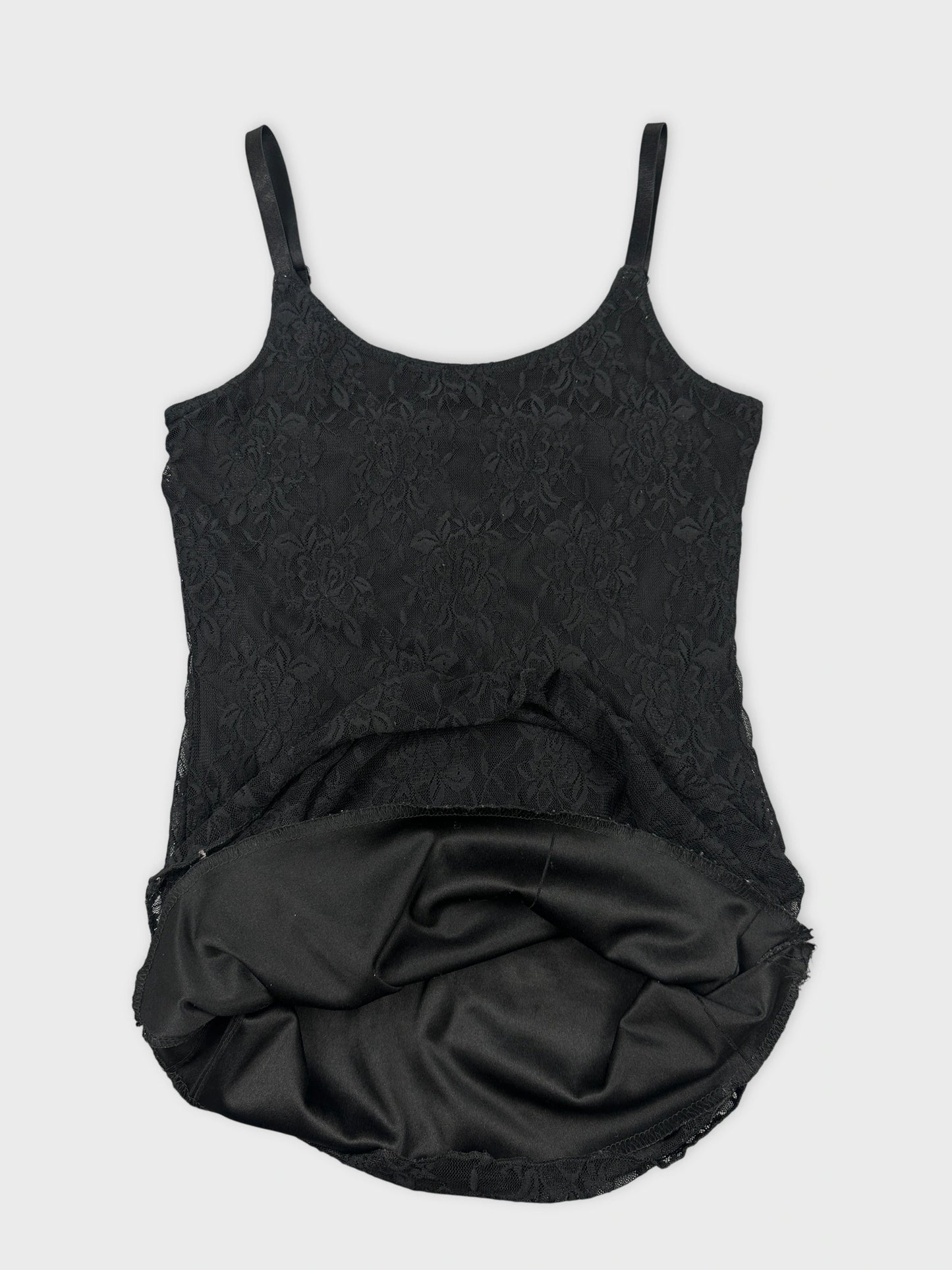 Detail view of black lace camisole top with spaghetti straps