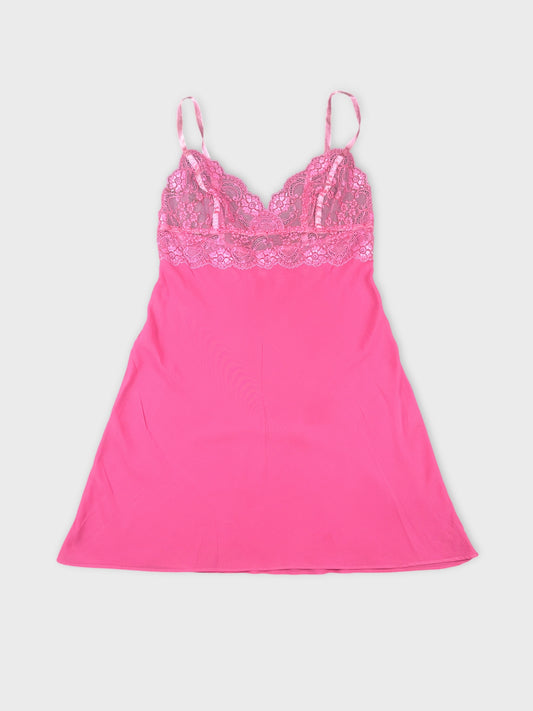 Front view of a pink lace cami top featuring delicate lace trim.