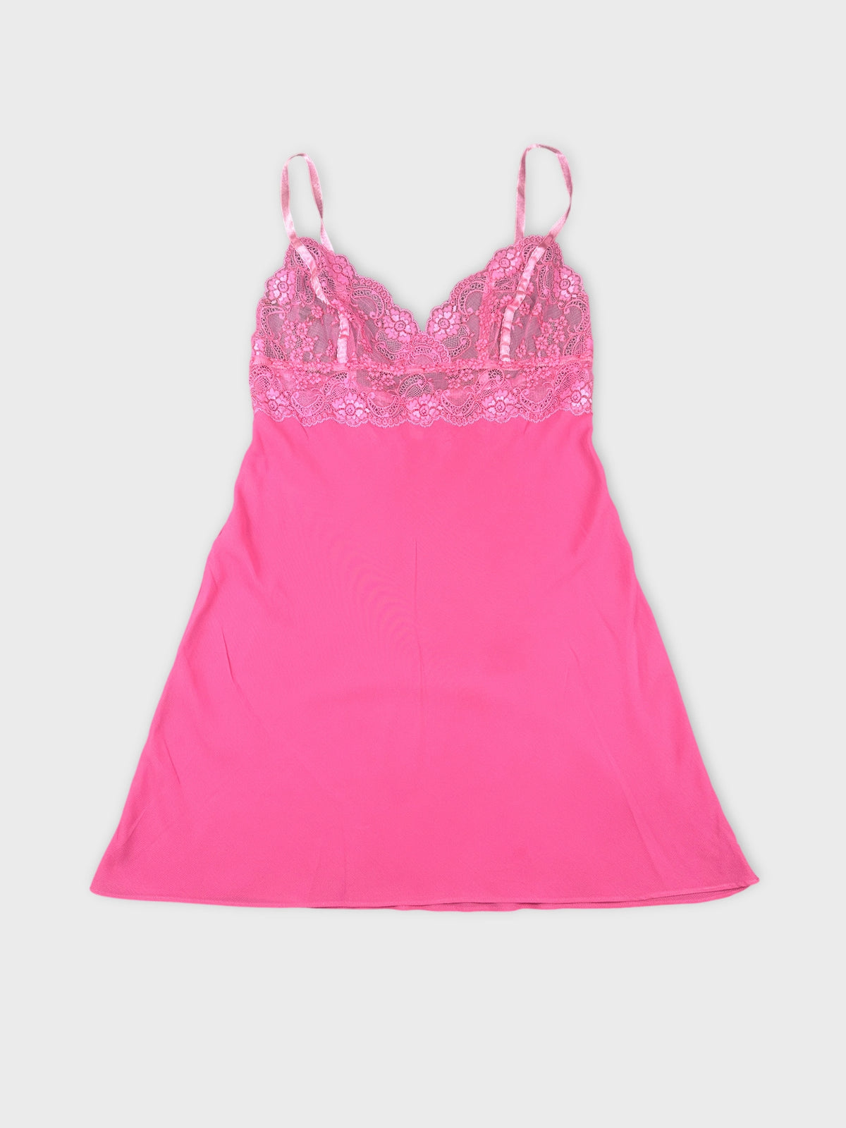 Front view of a pink lace cami top featuring delicate lace trim.