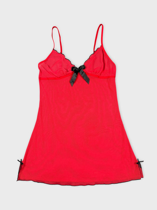 Red vintage camisole with black trim and bow detail front view.