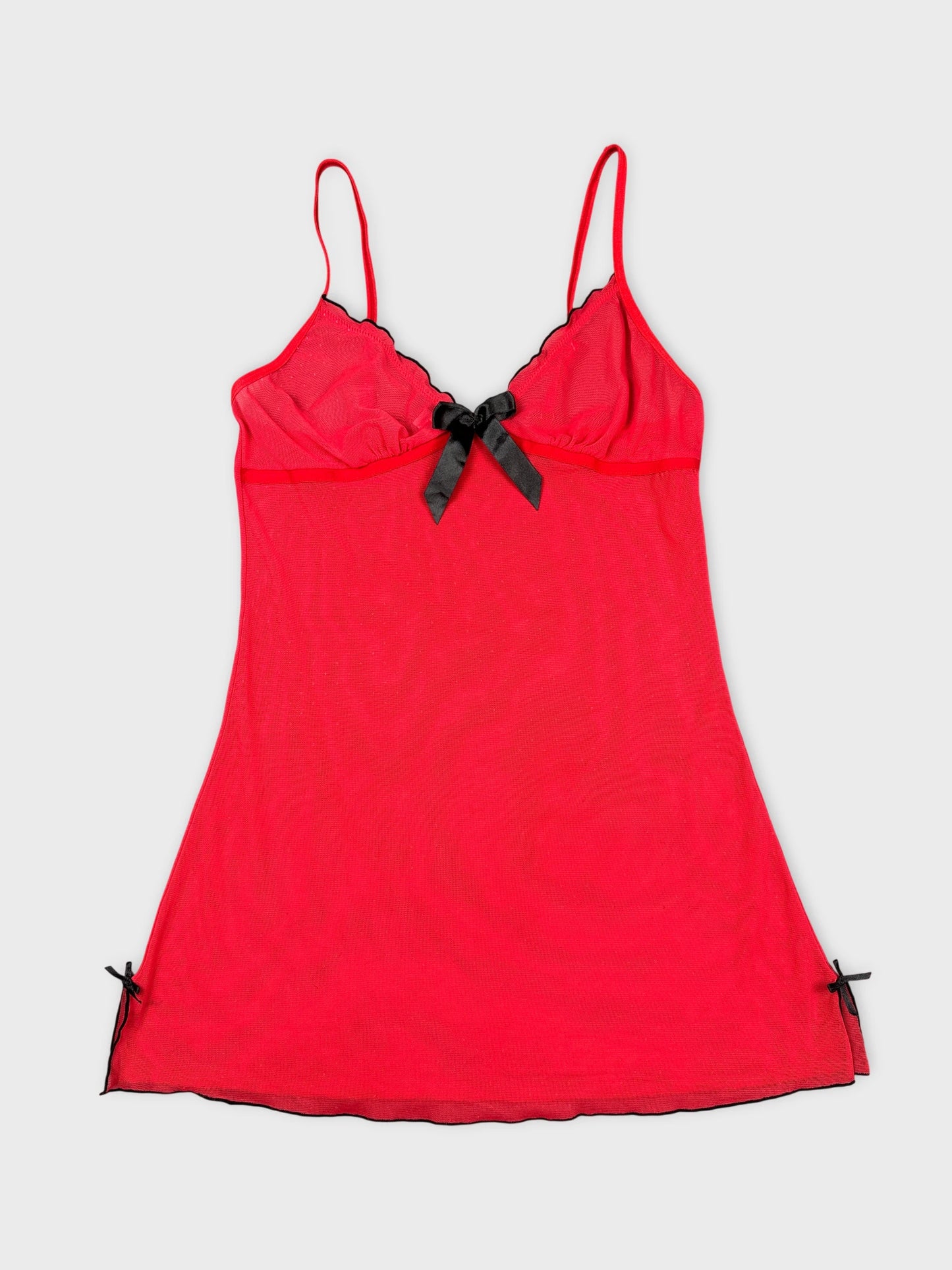 Red vintage camisole with black trim and bow detail front view.