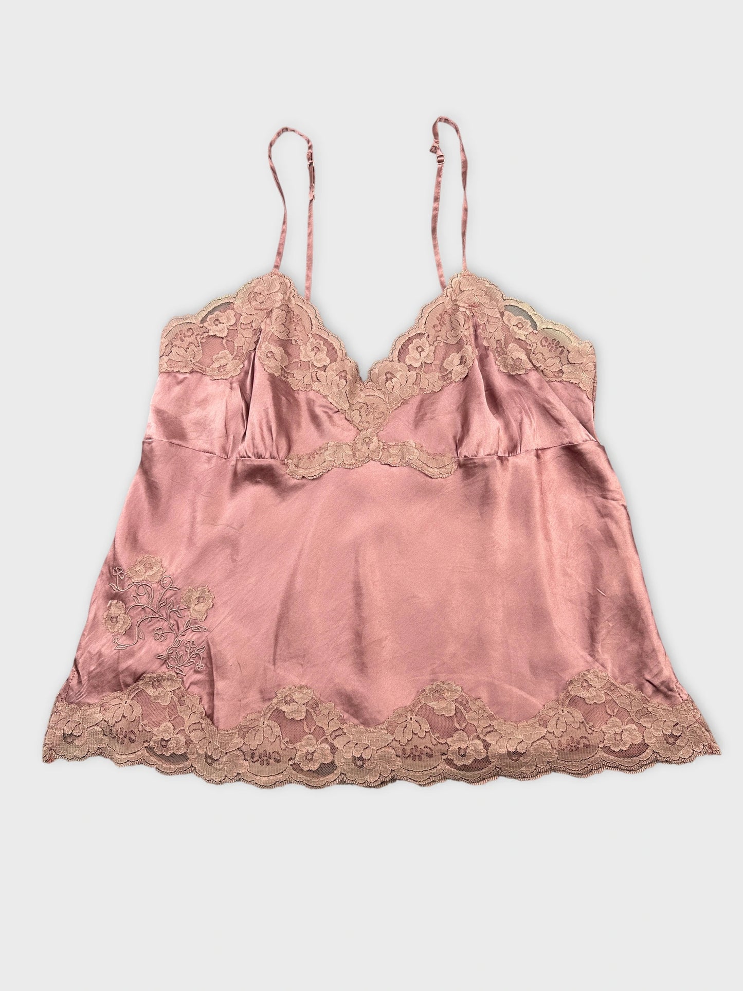 Front view of a pink satin tank top with lace trim.